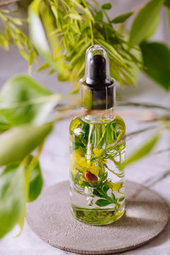 Essential oil, with flowers and natural herbs