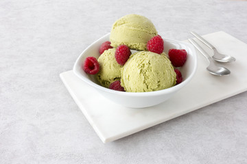 Bowl with Matcha Ice Cream on Marble Chopping Board