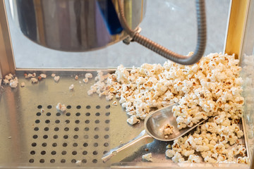 popcorn in a box machine and spoon