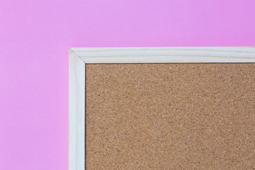 Fototapeta premium Isolate of wooden pin frame on pink background on bottom right