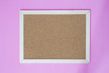 Fototapeta premium Isolate of wooden pin frame on pink background