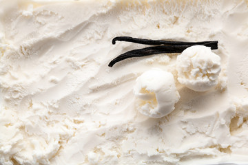 Tasty vanilla ice cream and sticks, closeup