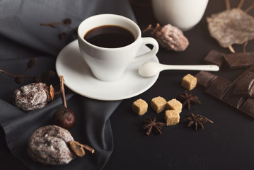 Coffee cup and sweets on vintage wooden table