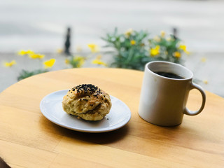 Salted Pastry with Poppy Seeds Served with Coffee at Cafe Shop Garden Outside Street Food.