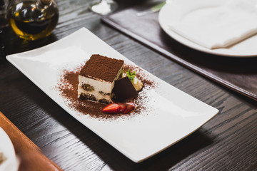 Tiramisu is a popular coffee-flavoured Italian dessert. It is made of ladyfingers dipped in coffee, layered with a whipped mixture of eggs, sugar, and mascarpone cheese, flavoured with cocoa.