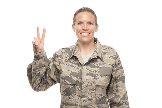 Female airman with peace sign