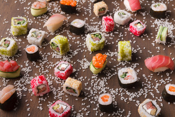 Assortment of colorful sushi and rolls background