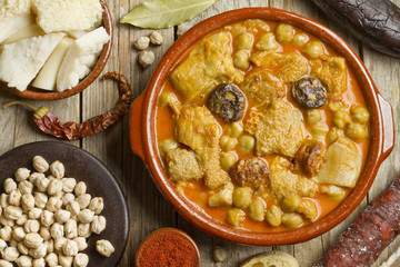 Spanish callos with chickpeas on a wooden table