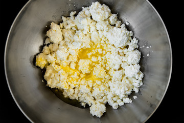 Cottage cheese with butter and egg. Preparation of cookies. Top view