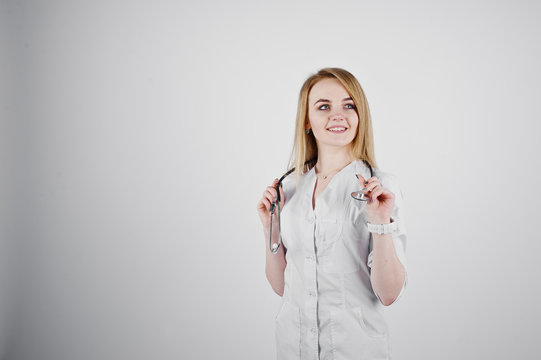 Blonde doctor nurse with stethoscope isolated on white background.