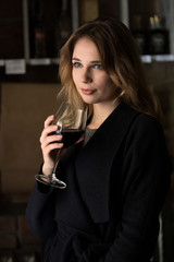 Woman holding wine glass