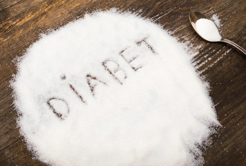 Diabet sign made of granular sugar. The picture illustrates the harm of eating sugar and salt, as well as the incidence of diabetes.