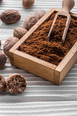 aromatic nutmeg on a gray wooden background