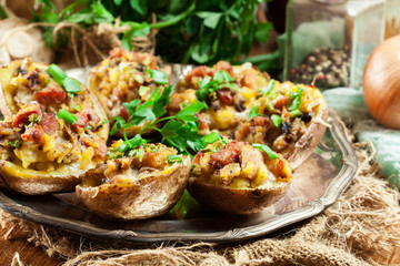 Baked potatoes stuffed with bacon, mushrooms and cheese