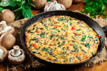 Frittata made of eggs, mushrooms and spinach