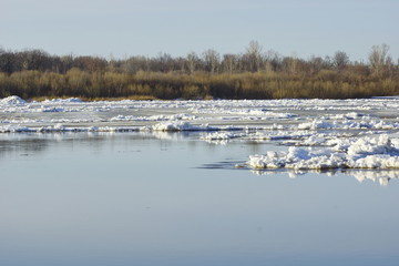 ice drift on the river. large ice floes float.