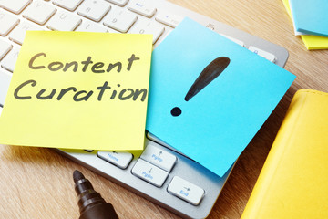 Content Curation. Memo stick on a keyboard.
