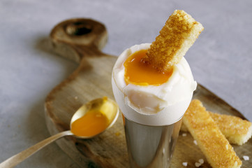 Breakfast. eggs soft-boiled on a gray background.