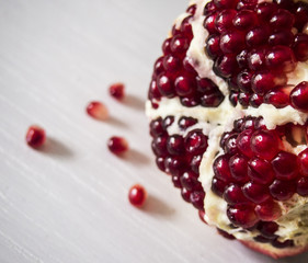 ripe pomegranate on a white table