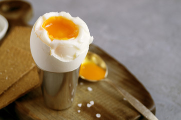 Breakfast. eggs soft-boiled on a gray background.