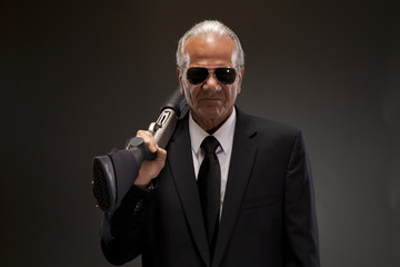 Businessman with shotgun