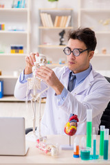 Funny doctor having fun in hospital lab