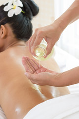 woman lying down on a massage bed at a spa
