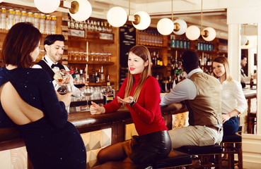 Young people are relaxing near bar counter