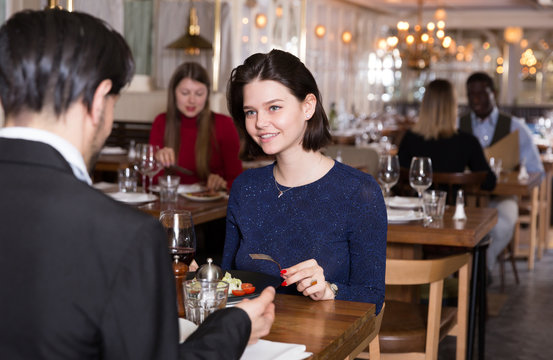 Woman with man partner in restaurant
