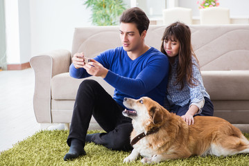 Happy family with golden retriever dog