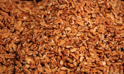 Peeled walnuts kernels background, proper snack for vegan, vegetarian and people on diet.