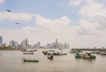 Fototapeta na wymiar cityscape landscape, modern skyline and fisher boats, Panama City