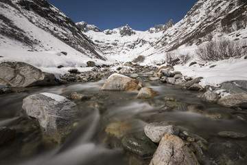 Fototapeta na wymiar Long exposure of a creek in the Meiental in the Alps in central Switzerland