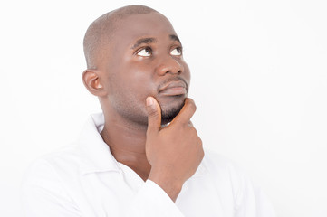 young doctor thinking with his hand on his chin