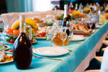 Served table in the restaurant with glasses, napkins and cutlery