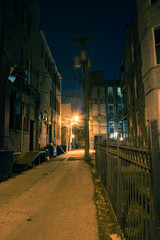 Dark and eerie urban city alley at night