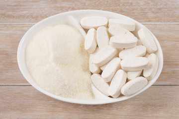 Fototapeta na wymiar Pills and collagen protein powder