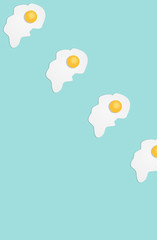 Broken egg on a light blue background