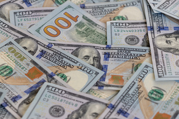 hundred-dollar bills are chaotically lying