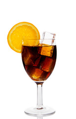 Cola drink poured in glass