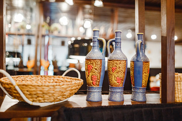 Interior of a Georgian traditional cuisine restaurant decorated with wine or cha-cha clay jugs