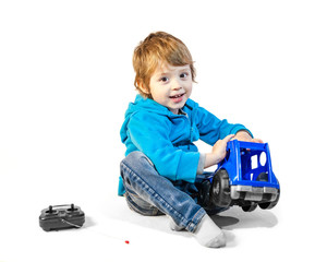 child boy playing with toys isolated on white