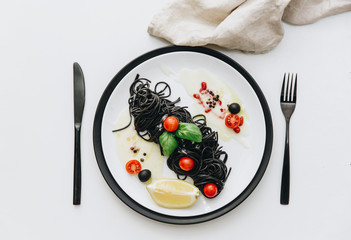 Black seafood pasta, spaghetti. Mediterranean delicious food. . Flat lay. Top view