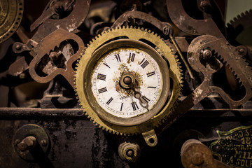 Golden rusty aged clock mechanism width roman numbers
