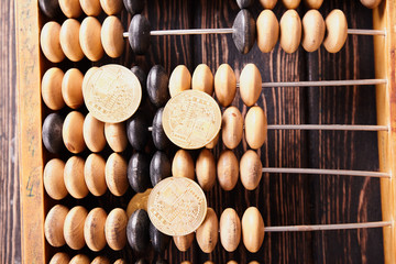 Vintage abacus on wooden background