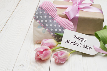 beautiful tulips with gift box. happy mothers day, romantic still life, fresh flowers.
