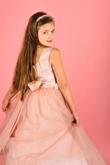 Fashion and beauty, little princess. Look, hairdresser, makeup. Fashion model on pink background, beauty. Little girl in fashionable dress, prom. Child girl in stylish glamour dress, elegance.
