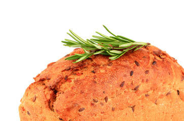Fresh baked bread with rosemary branch closeup.