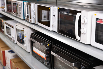 Image of assortment of a kitchen microwave at household  appliances store