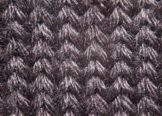 the texture of the knits on the needles close-up
